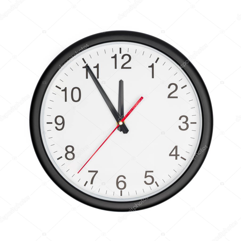 Five minutes to twelve on a wall clock on white background