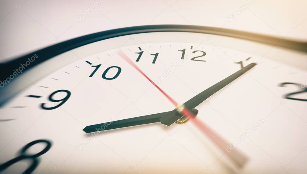 Round office clock in motion