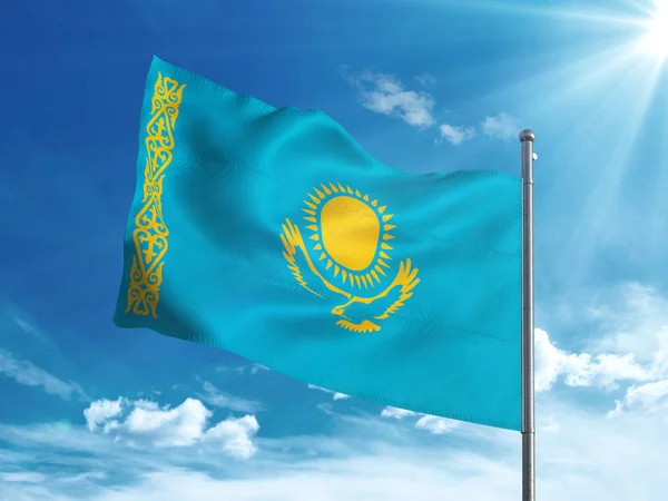 Kazakh flag waving in the blue sky — Stock Photo, Image