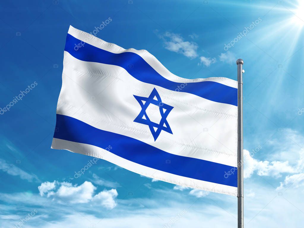 Israeli flag waving in the blue sky