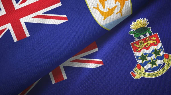 Anguilla és Kajmán-szigetek két zászló textil ruha, szövet textúra — Stock Fotó