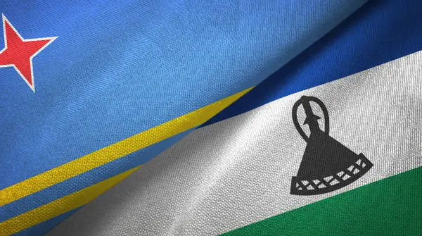 Aruba a Lesotho dvě vlajky textilní tkaniny, textura tkaniny — Stock fotografie