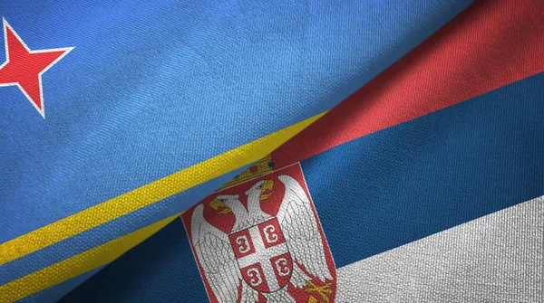 Aruba and Serbia two flags textile cloth, fabric texture — стокове фото