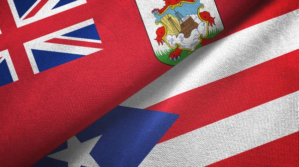 Bermudy i Portoryko dwie flagi tkaniny tekstylne, tekstura tkaniny — Zdjęcie stockowe