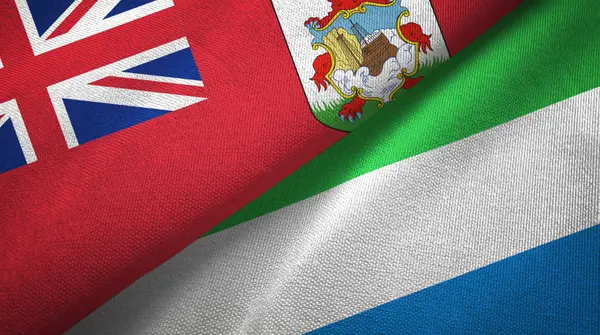 Βερμούδες και Σιέρα Λεόνε δύο σημαίες ύφασμα, υφασμάτινη υφή — Φωτογραφία Αρχείου