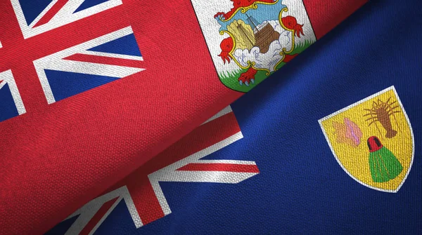 Bermudas y Islas Turcas y Caicos dos banderas de tela textil, textura de tela — Foto de Stock