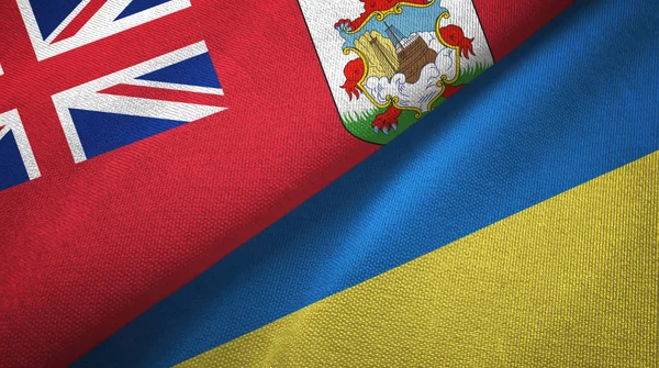 Bermudas e Ucrânia duas bandeiras de pano têxtil, textura de tecido — Fotografia de Stock
