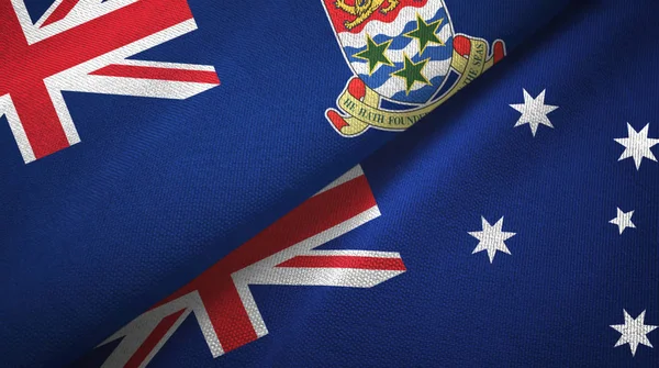Islas Caimán y Australia dos banderas tela textil, textura de la tela — Foto de Stock