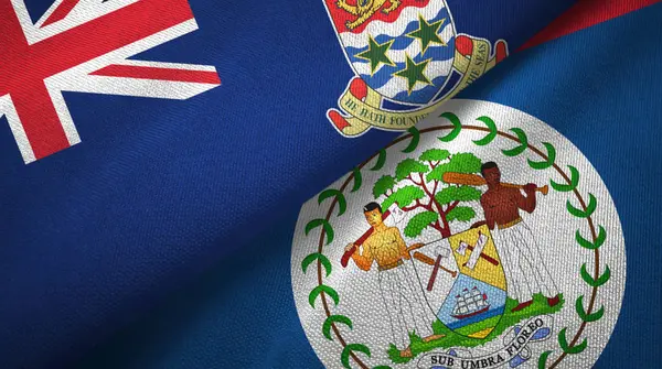 Kajmanské ostrovy a Belize dvě vlajky textilní tkaniny, textura tkaniny — Stock fotografie