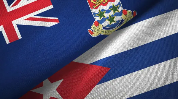 Islas Caimán y Cuba dos banderas tela textil, textura de la tela —  Fotos de Stock