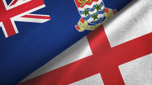 Kajmán-szigetek és Anglia két zászlós textilszövet, szövet textúra — Stock Fotó