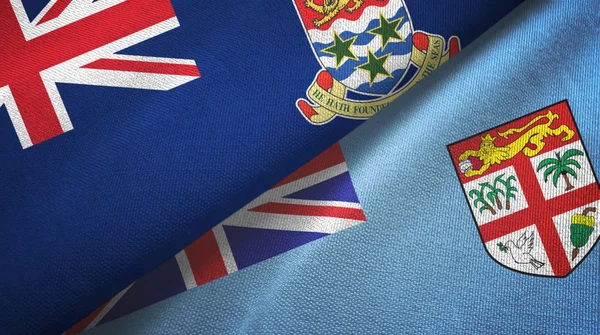 Islas Caimán y Fiji dos banderas tela textil, textura de la tela —  Fotos de Stock