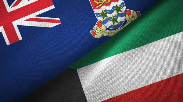 Islas Caimán y Kuwait dos banderas tela textil, textura de la tela — Foto de Stock