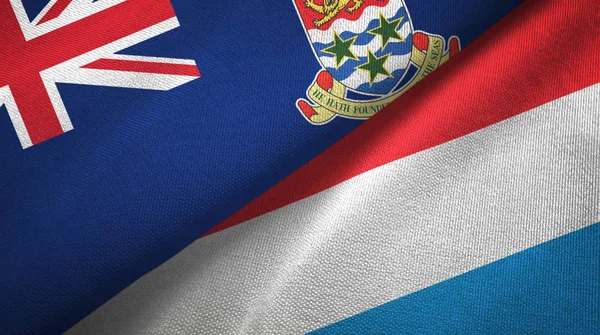 Isole Cayman e Lussemburgo due bandiere tessuto, tessitura tessuto — Foto Stock