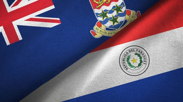 Isole Cayman e Paraguay due bandiere tessuto, tessitura del tessuto — Foto Stock