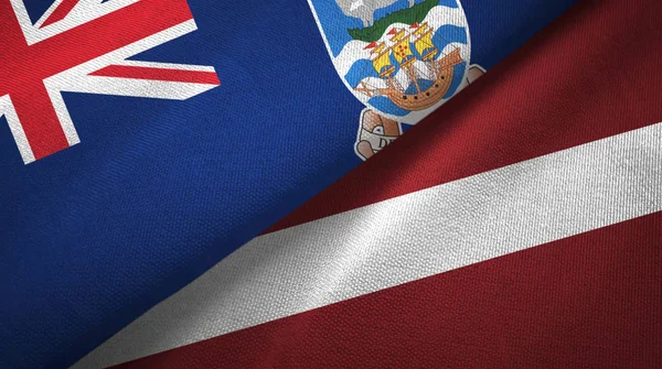 Νήσοι Φώκλαντ και Λετονία δύο σημαίες ύφασμα, υφασμάτινη υφή — Φωτογραφία Αρχείου
