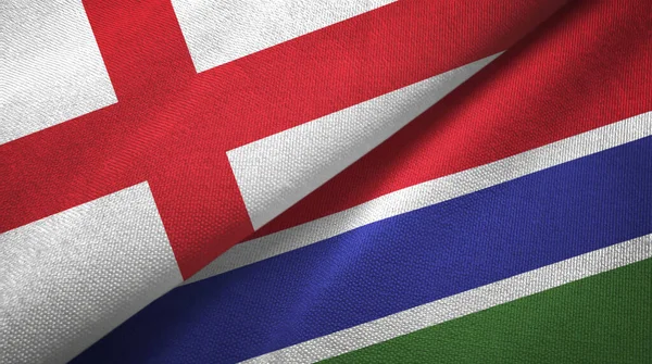 Engeland en Gambia twee vlaggen textiel doek, stof textuur — Stockfoto