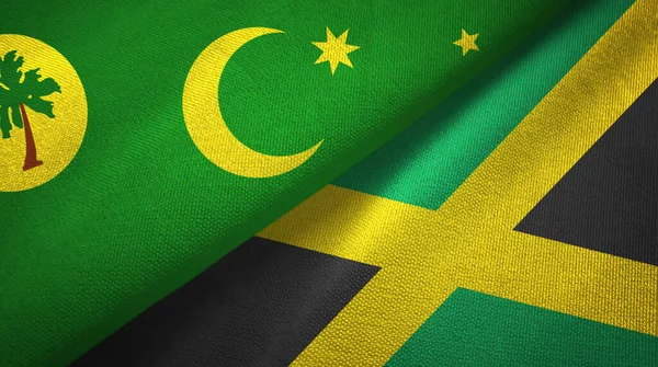 Cocos Keeling Islands y Jamaica dos banderas tela textil, textura de la tela —  Fotos de Stock