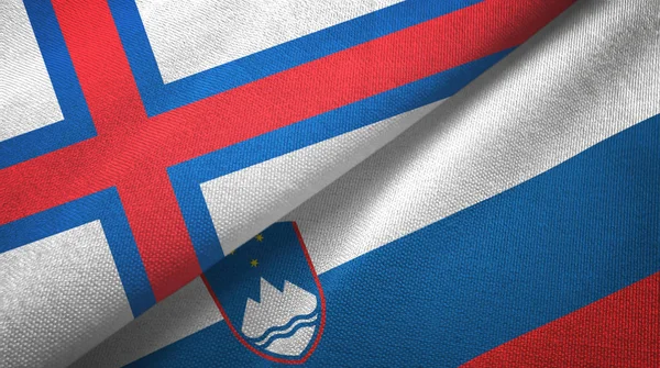 Feröer-szigetek és Szlovénia két zászlós textilszövet, szövet textúra — Stock Fotó