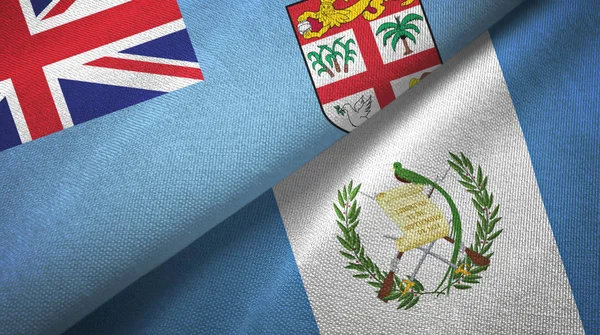 Fidschi und Guatemala zwei Flaggen Textiltuch, Textur — Stockfoto