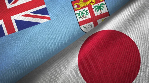 Fiji and Japan two flags textile cloth, fabric texture