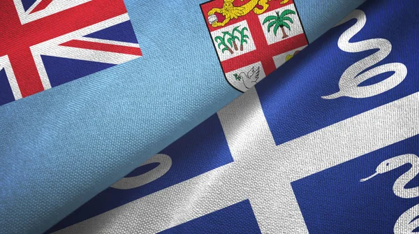 Fiji y Martinica serpiente dos banderas tela textil, textura de la tela — Foto de Stock