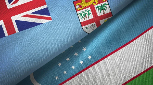 斐济和乌兹别克斯坦两国国旗纺织品，面料质感 — 图库照片