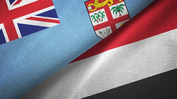 Fiji e Iêmen duas bandeiras de pano têxtil, textura de tecido — Fotografia de Stock