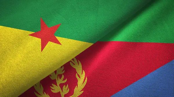 Guayana Francesa y Eritrea dos banderas tela textil, textura de la tela — Foto de Stock