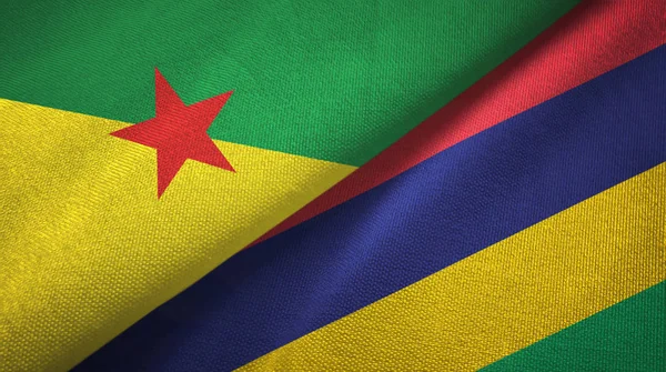 Frans-Guyana en Mauritius twee vlaggen textiel doek, stof textuur — Stockfoto