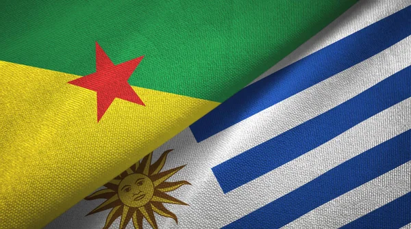 Französisch Guiana und Uruguay zwei Flaggen Textiltuch, Textur — Stockfoto