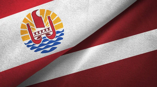 Franska Polynesien och Lettland två flaggor textilduk, textur — Stockfoto