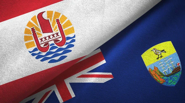 Polynésie française et Sainte-Hélène deux drapeaux tissu textile, texture du tissu — Photo