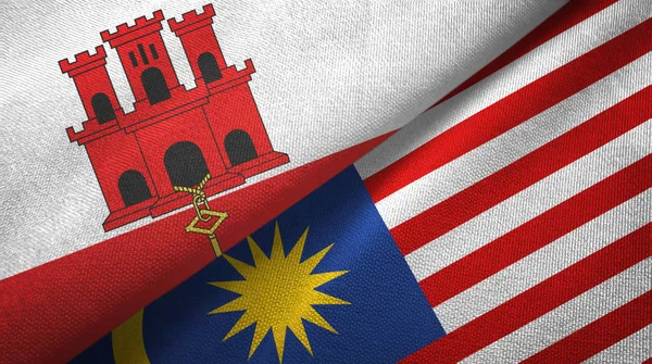 Gibraltar and Malaysia two flags textile cloth, fabric texture — Stock Photo, Image