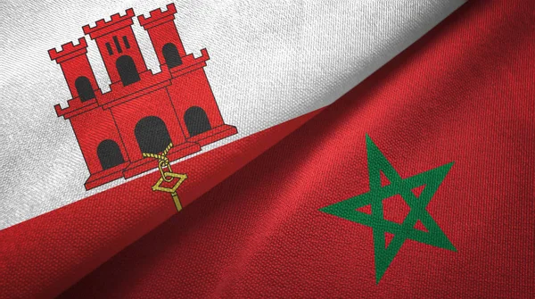 Gibraltar en Marokko twee vlaggen textiel doek, stof textuur — Stockfoto