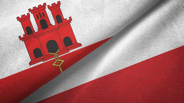 Gibraltar och Polen två flaggor textilduk, tyg struktur — Stockfoto