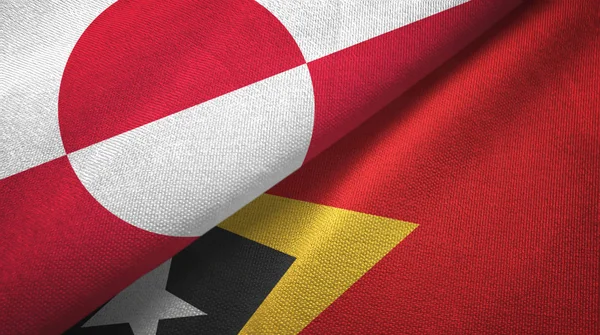 Greenland and Timor-Leste East Timor two flags textile cloth, fabric texture — ストック写真