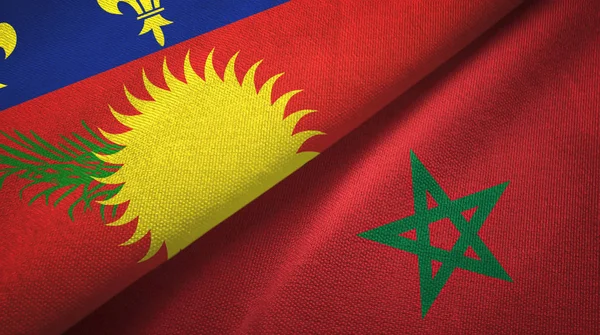 Guadeloupe en Marokko twee vlaggen textiel doek, stof textuur — Stockfoto