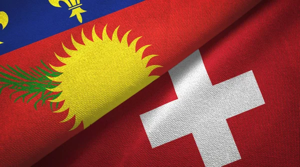 Guadeloupe och Schweiz två flaggor textil duk, textur — Stockfoto