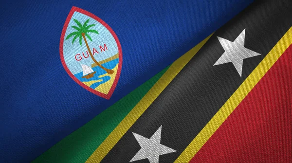 Guam en Saint Kitts en Nevis twee vlaggen textiel doek, stof textuur — Stockfoto