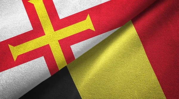 Guernsey en België twee vlaggen textiel doek, stof textuur — Stockfoto