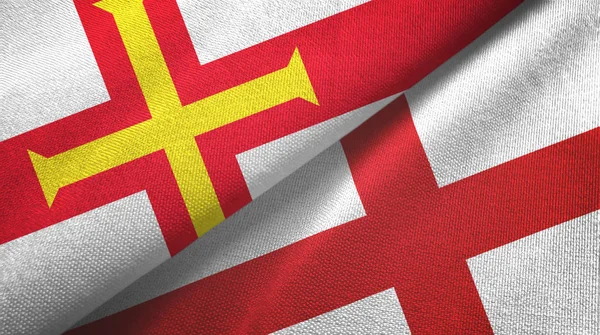 Guernsey und england zwei flaggen textiltuch, textur — Stockfoto