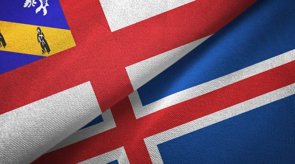Herm en IJsland twee vlaggen textiel doek, stof textuur — Stockfoto
