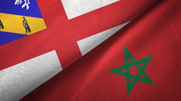 Herm en Marokko twee vlaggen textiel doek, stof textuur — Stockfoto
