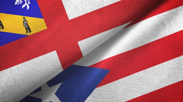 Herm a Portoriko dvě vlajky textilní látky, textura tkaniny — Stock fotografie