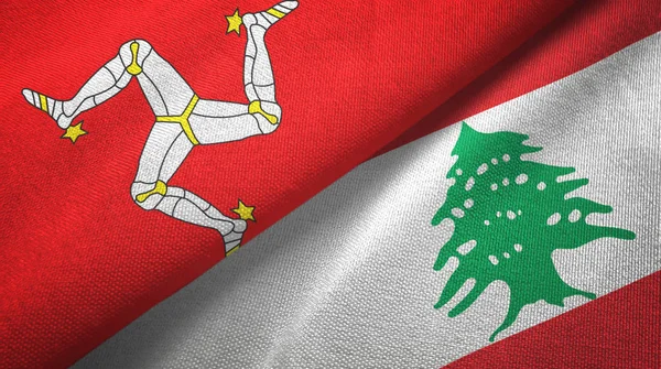 Île de Mann et Liban deux drapeaux tissu textile, texture du tissu — Photo