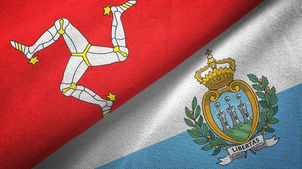 Isla de Mann y San Marino dos banderas tela textil, textura de la tela — Foto de Stock