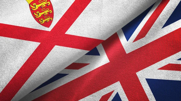 Jersey och Storbritannien två flaggor textilduk, tyg struktur — Stockfoto