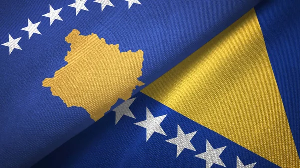 Kosovo y Bosnia y Herzegovina dos banderas tela textil, textura de la tela — Foto de Stock