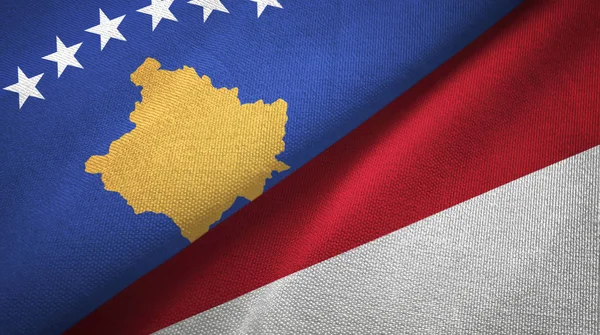 Kosovo e Indonesia due bandiere tessuto, tessitura tessuto — Foto Stock